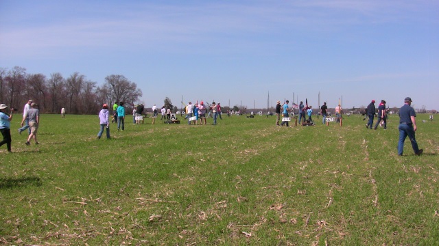 The field was crowded with
        rocketeers between launch racks