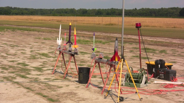 Flyers setting up the projects on the B-Rack in the August
        sun