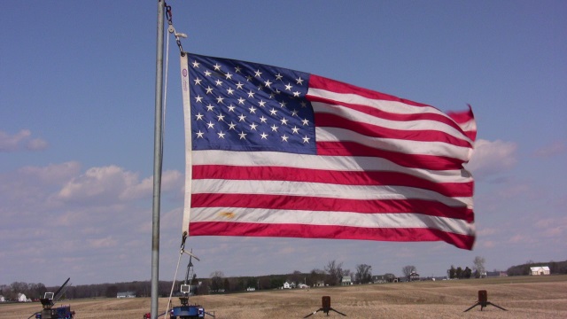 Stiff winds kept
        the flag flying