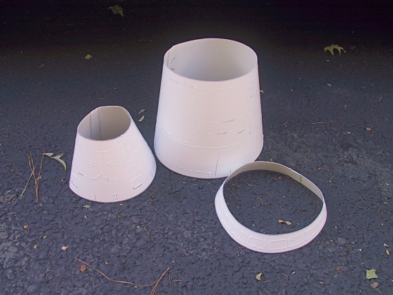 Completed carboard shrouds with fabric painted details