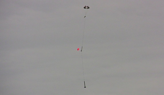 Shaken, Not Stirred descending under main parachute