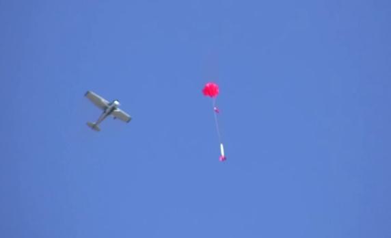 Plane flying over Maxi Alpha in restricted air space